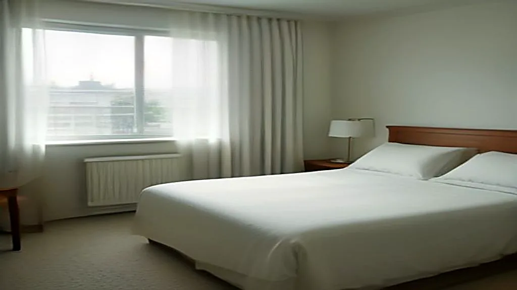 A bright hotel-style bedroom